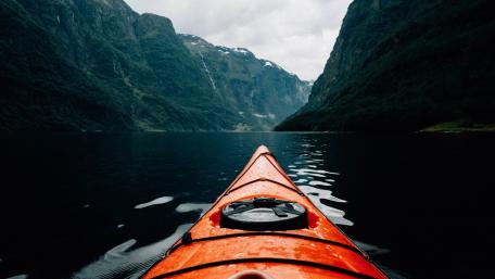 Kayak Adventure in Majestic Fjord wallpaper