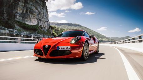 Dreamy Red Alfa Romeo on a Scenic Drive wallpaper