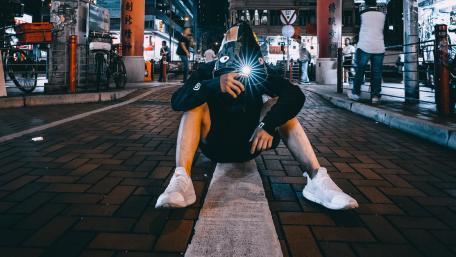 Man sitting on the street wallpaper