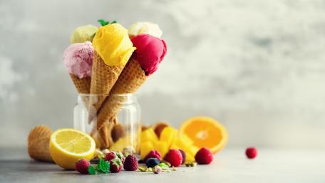 Delicious Ice Cream Cones in a Jar Decorated with Fresh Fruits wallpaper