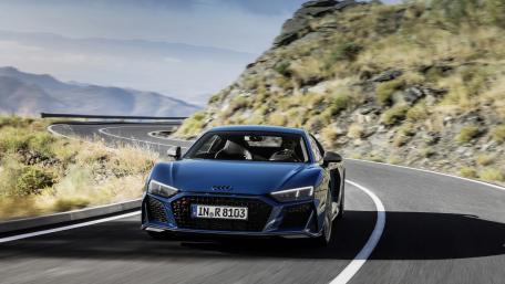 Sleek Audi R8 on a Scenic Roadway wallpaper