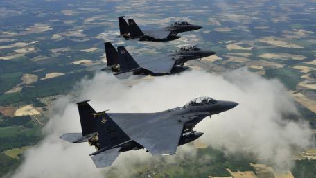 Fighter Jets in Formation Above the Clouds wallpaper