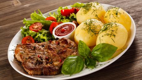 Savoring Delicious Pork and Potatoes Meal Experience wallpaper