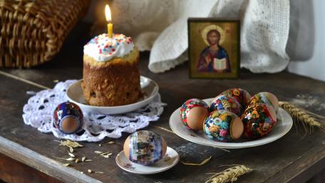 Easter Celebration with Colorful Eggs and Candlelit Atmosphere wallpaper