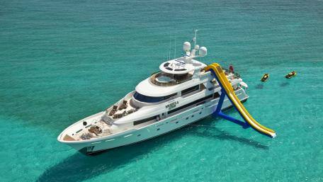 Luxury Yacht with Water Slide on Crystal Clear Water wallpaper