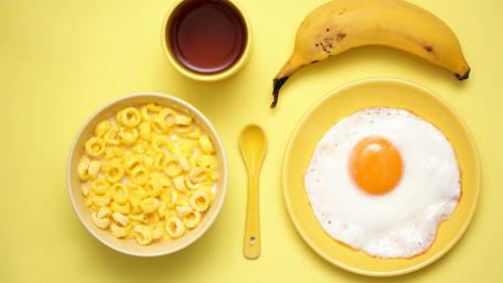 Sunny Breakfast Delight on Yellow Background wallpaper