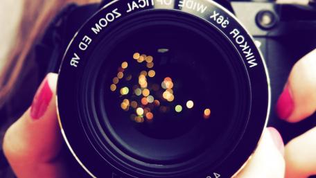 Lens Reflections in a Camera's Gaze wallpaper