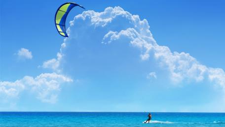 Windsurfing Adventure Under a Blue Sky wallpaper