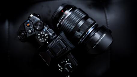 Sleek Camera Gear in Darkness for Creative Minds wallpaper