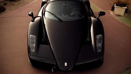 Sleek Black Ferrari Enzo Supercar Wallpaper wallpaper