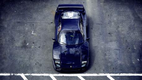 Sleek Supercar in Urban Setting wallpaper