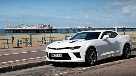 Sleek White Chevrolet Camaro by the Beach wallpaper