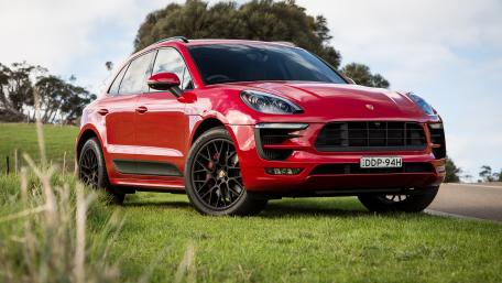 Red Porsche Macan Captivating Beauty in Motion wallpaper