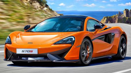 Striking McLaren 570S in Orange on Coastal Drive wallpaper