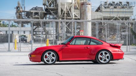 Red Porsche in Urban Industrial Setting wallpaper