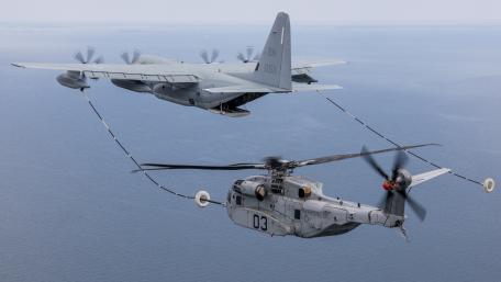 Military Aircraft in Action Above the Sea wallpaper