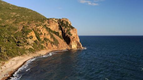 Coastal Serenity with Rocky Cliffs and Calm Waters wallpaper