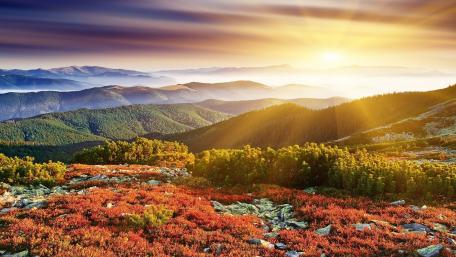 Golden Sunrise Over Majestic Mountains wallpaper