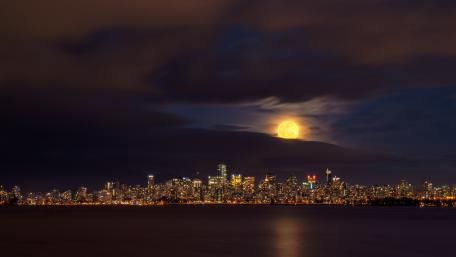 Glistening City Under the Full Moon wallpaper