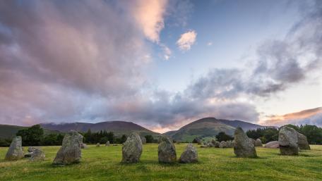 Ancient Stones Amidst Rolling Hills wallpaper