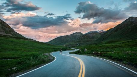 Winding Highway Through Serene Valley wallpaper