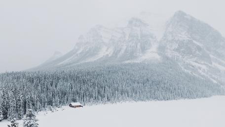 Snowy Cabin Retreat in Winter Wonderland wallpaper