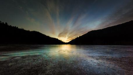 Serene Twilight Over a Tranquil Lake wallpaper
