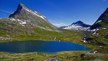 Majestic Mountain Valley Under a Blue Sky wallpaper