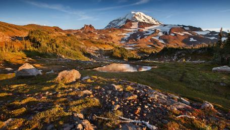 Majestic Mountain Reflection in Tranquil Wilderness Pond wallpaper