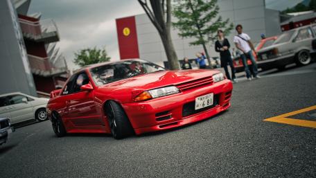 Vibrant Red Car Showcasing Automotive Style and Elegance wallpaper
