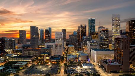 Sunset Over a Vibrant City Skyline wallpaper