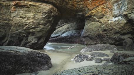 Serene River Passage Through Majestic Rock Formation wallpaper
