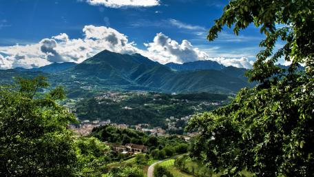 Breathtaking Mountain View Over Town Landscape wallpaper