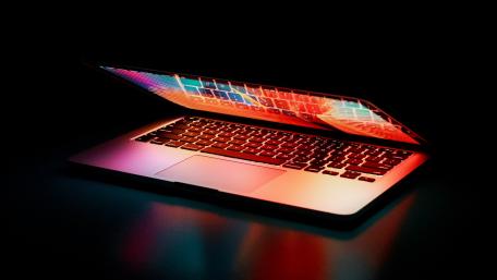Illuminated Laptop Keyboard in Dark Setting wallpaper