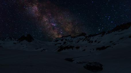 Majestic Milky Way Over Winter Mountains wallpaper