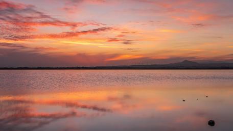Serene Sunset Over Tranquil Lake wallpaper