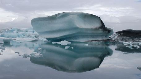 Melting Ice Cap Reflections in the Arctic Water wallpaper