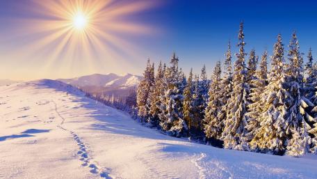 Winter Sunshine Over Snowy Mountains wallpaper