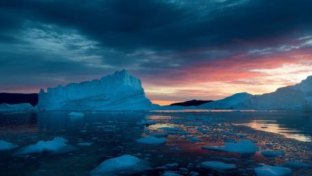 Majestic Iceberg Under Cloudy Sky wallpaper