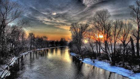 Winter's Tranquil Embrace Along the Riverbanks wallpaper