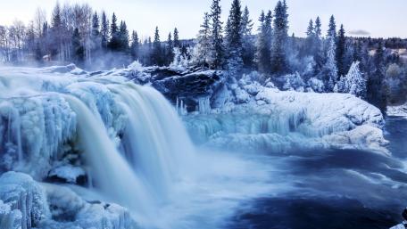 Icy Winter Waterfall in Serene Blue Landscape wallpaper