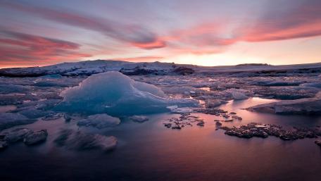 Serene Winter Sunrise Over Iceberg Shoreline wallpaper