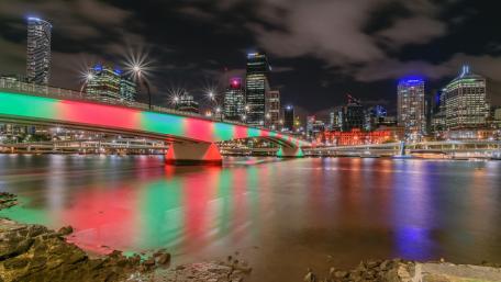 Vibrant City Lights Reflecting on Water wallpaper