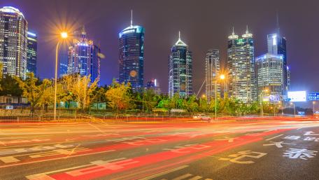 Vibrant City Nightscape with Light Trails wallpaper