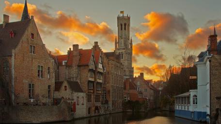 Charming Sunset Over Historic Canal City wallpaper