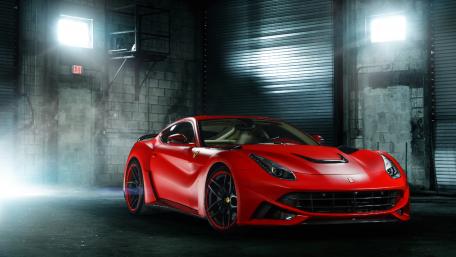 Stunning Red Ferrari in a Dramatic Setting wallpaper