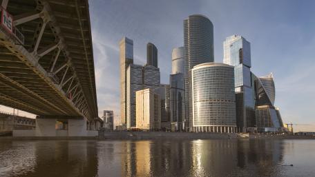 Modern Skyline Reflection Over Water wallpaper