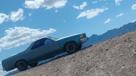 Vintage Pickup against Majestic Landscape View wallpaper