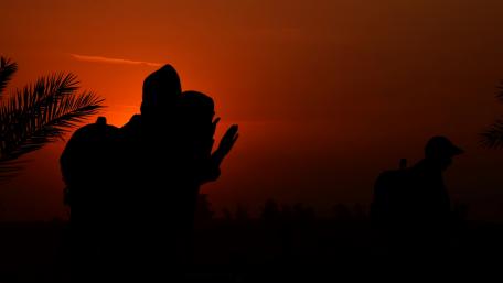 Silhouette Against a Fiery Sunset wallpaper