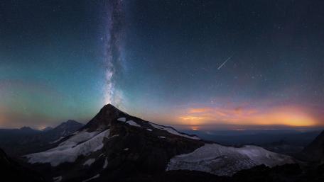 Majestic Milky Way Over Mountain Peaks wallpaper